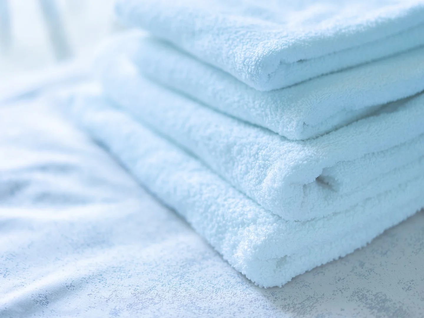 Folded cotton towels arranged together.