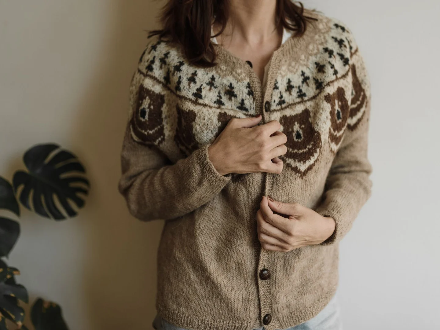 A knitted cardigan with buttons and textured stitching.