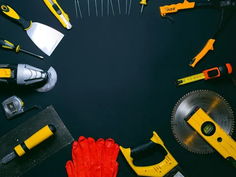 A selection of hand tools laid out together.