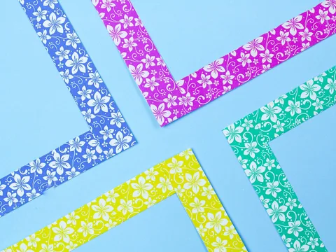Patterned paper borders arranged against a blue background.