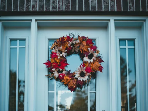 An autumn wreath decorating a front door.