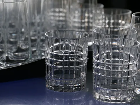Clear drinking glasses with faceted sides.