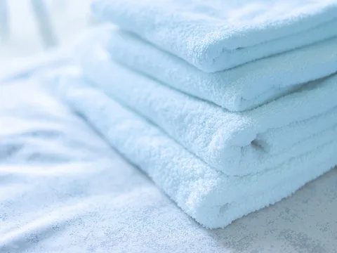 Folded cotton towels arranged together.